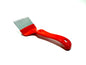 red plastic uncapping fork