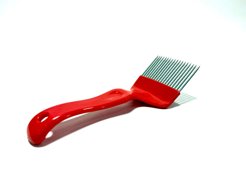 red plastic uncapping fork